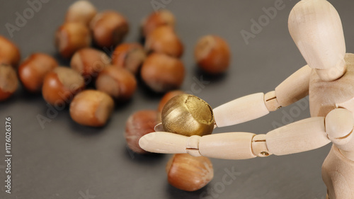 Find the golden nut or nugget among the hollow nuts - with blurred background