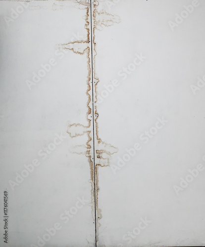 Water stains on the ceiling indoors. Usually caused by heavy rain which then leaves a mark