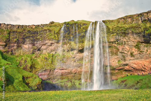 Seljalandsfoss waterfall summer 2024 at sunset including Gljúfrabúi falls off Ring Road Iceland, Scandinavia, Europe.