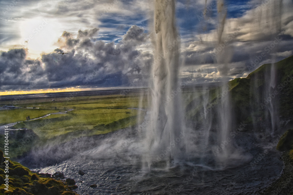 Seljalandsfoss waterfall summer 2024 at sunset including Gljúfrabúi falls off Ring Road Iceland, Scandinavia, Europe. Seljalandsfoss waterfall summer 2024 at sunset including Gljúfrabúi falls off Ring Road Iceland, Scandinavia, Europe.