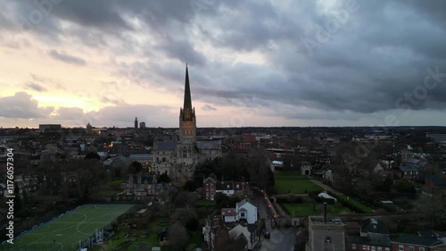 A breathtaking 4K drone swoop over Norwich, capturing the cathedral at sunset with the warm light of evening. Ideal for cinematic or atmospheric content featuring iconic architecture.

