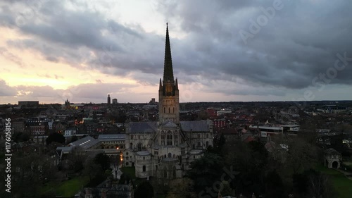 A powerful 4K aerial drone shot of Norwich at sunset, featuring the iconic cathedral at the centre. The dynamic light and vibrant sunset colours bring out the city's historic charm, perfect for cinema