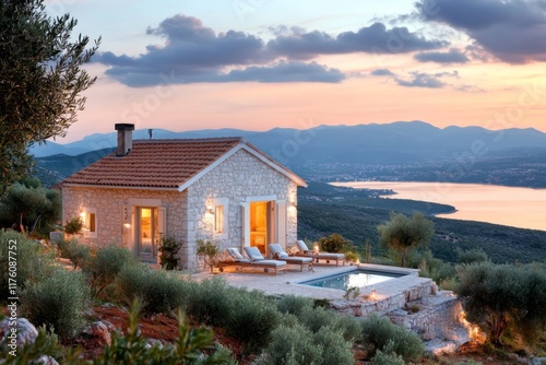 A traditional Croatian stone house in Kvarner, nestled amidst olive trees and overlooking the sea