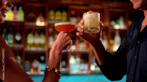 Couple enjoying cocktails together at a stylish bar during their holiday.