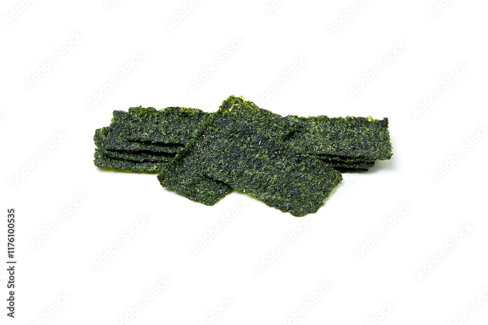 Fototapeta premium Crispy fried seaweed isolated on white background. Algae are plants that grow in lakes, rivers, and other bodies of water. Seaweed has many health benefits and is also a great snack for weight loss.