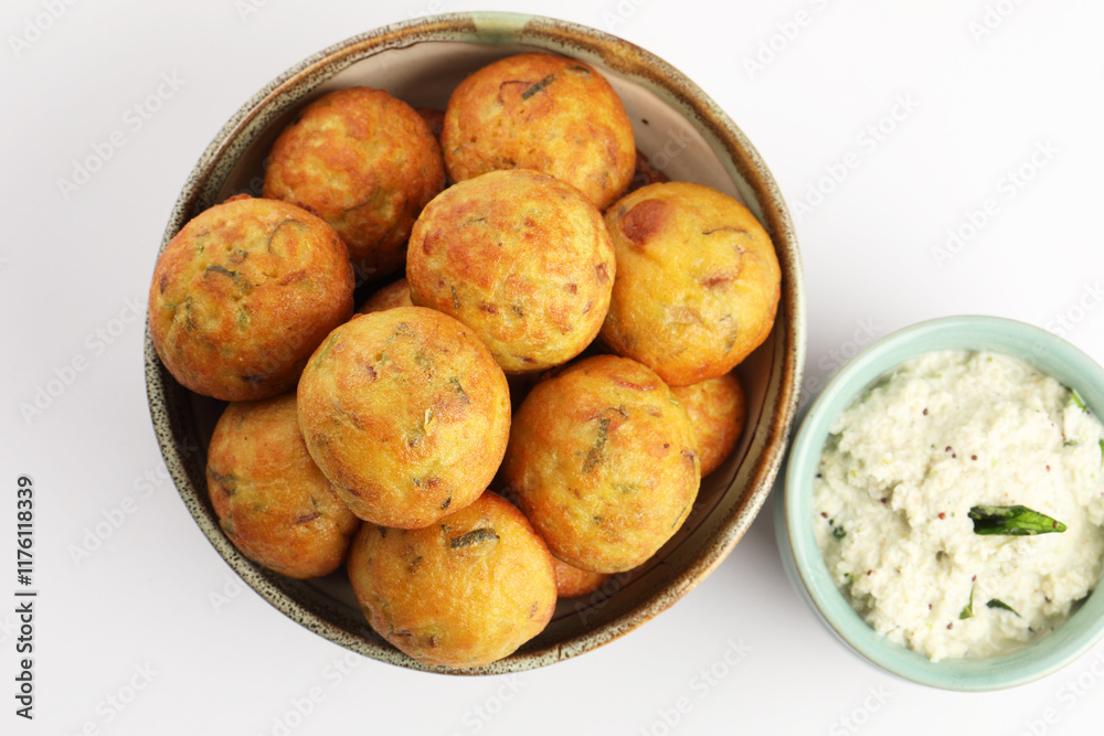 Kuzhi Paniyaram served with coconut chutney and sambar- South Indian breakfast Kuzhi Paniyaram served with coconut chutney and sambar- South Indian breakfast