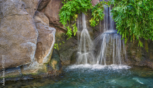 Double Waterfall with Green Foliage in a Tropical Setting.