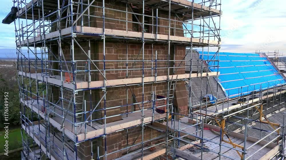 Church steeple tower scaffolding framework aerial view passing roof architecture reconstruction Church steeple tower scaffolding framework aerial view passing roof architecture reconstruction