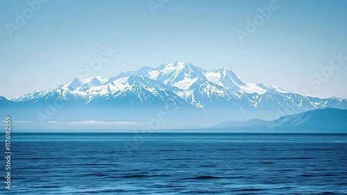 Stunning Scenic Beauty of Snow-Capped Mountains and Calm Ocean Waters: Tranquil Nature Landscape for Travel Inspiration and Serenity