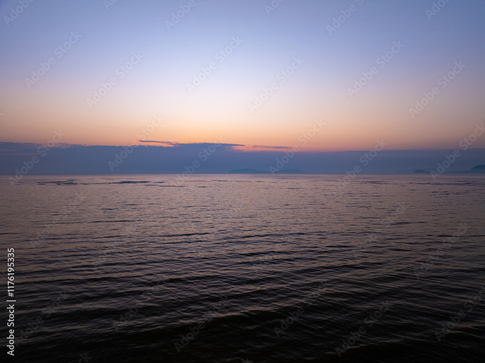 Obraz premium Aerial view sunset sky,Nature beautiful light sunset or sunrise over sea,Colorful scenery sunset sky,Amazing clouds and waves texture, sunrise sky background