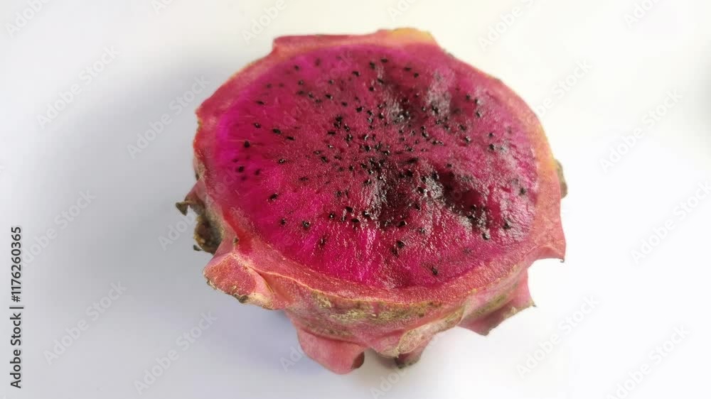 Dragon fruit, or pitaya, or Hylocereus spp is red on a white background.