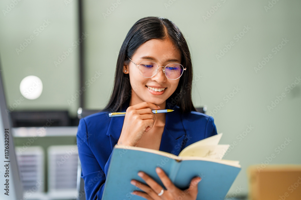 Naklejka premium A businesswoman sits at her desk in a modern office, working on a laptop. She browses an online banking website, managing finances, analyzing transactions, and making strategic business decisions.