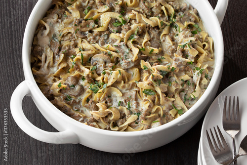 Family-Style Mushroom and Beef Stroganoff Noodle Dinner with creamy sour cream sauce and minced parsley photo