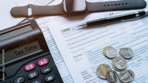 tax 2025 symbol. word TAX 2025 on a calculator with documents on the desk. Income tax filing and tax filing to pay tax documents online.