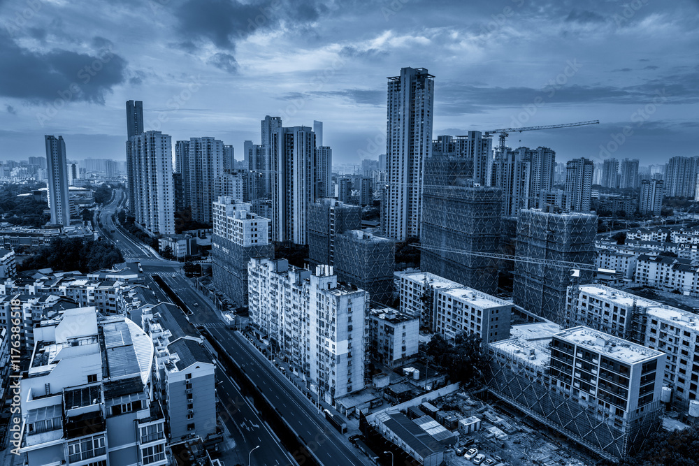 Obraz premium Urban Skyline in Blue Tones: Modern Architecture and City Life