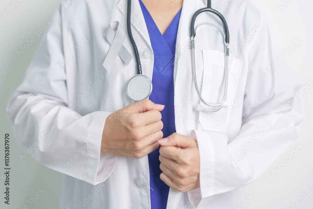 Brain Cancer Awareness May month, Doctor with grey color Ribbon for supporting life people. Healthcare and World cancer day concept Brain Cancer Awareness May month, Doctor with grey color Ribbon for supporting life people. Healthcare and World cancer day concept