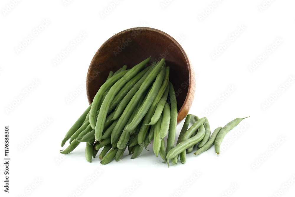 Fresh green beans spilling from wooden bowl on white background Fresh green beans spilling from wooden bowl on white background