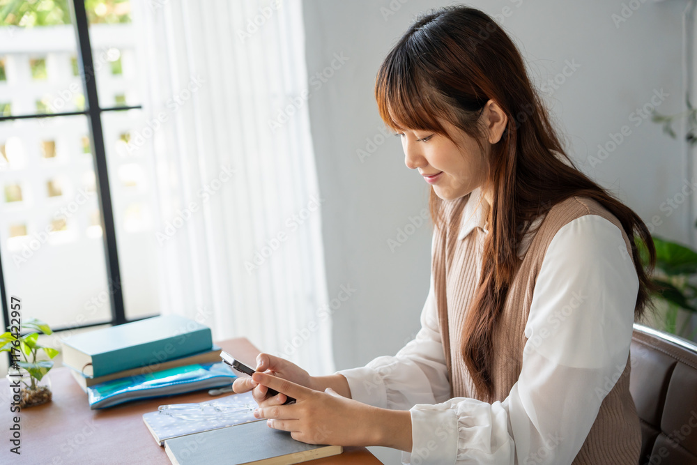 Student asian woman lying use smart phone in dorm room college mobile addict spending time checking news technology e-commerce. Student asian woman lying use smart phone in dorm room college mobile addict spending time checking news technology e-commerce.