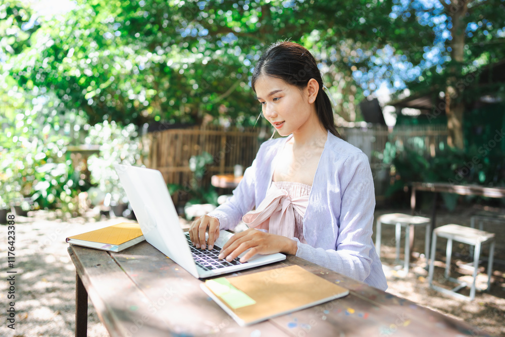 Beautiful confident freelancer asian young woman working with laptop Hands typing keyboard. digital nomad working remotely from outdoor eco cafe Workplace on nature outdoors Beautiful confident freelancer asian young woman working with laptop Hands typing keyboard. digital nomad working remotely from outdoor eco cafe Workplace on nature outdoors