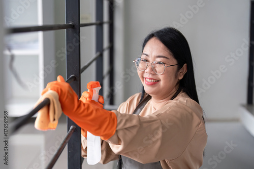 Efficient maid cleaning action in modern home indoor environment bright viewpoint emphasizing cleanliness and organization photo