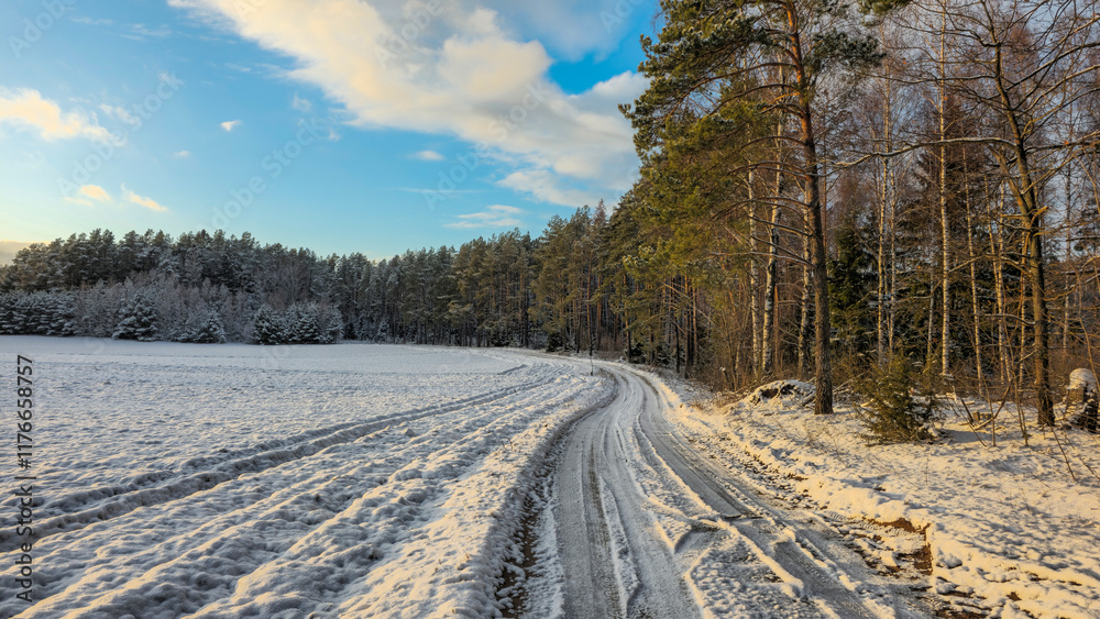 Peaceful winter landscape with snow-covered fields and trees at sunset Peaceful winter landscape with snow-covered fields and trees at sunset