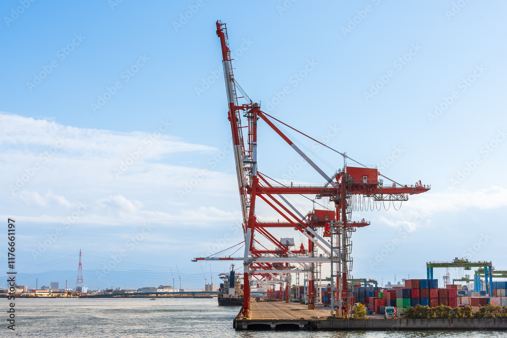 Container port and container crane at Industrial port for cargo container ship Osaka Japan. Business logistic transportation concept. Container port and container crane at Industrial port for cargo container ship Osaka Japan. Business logistic transportation concept.