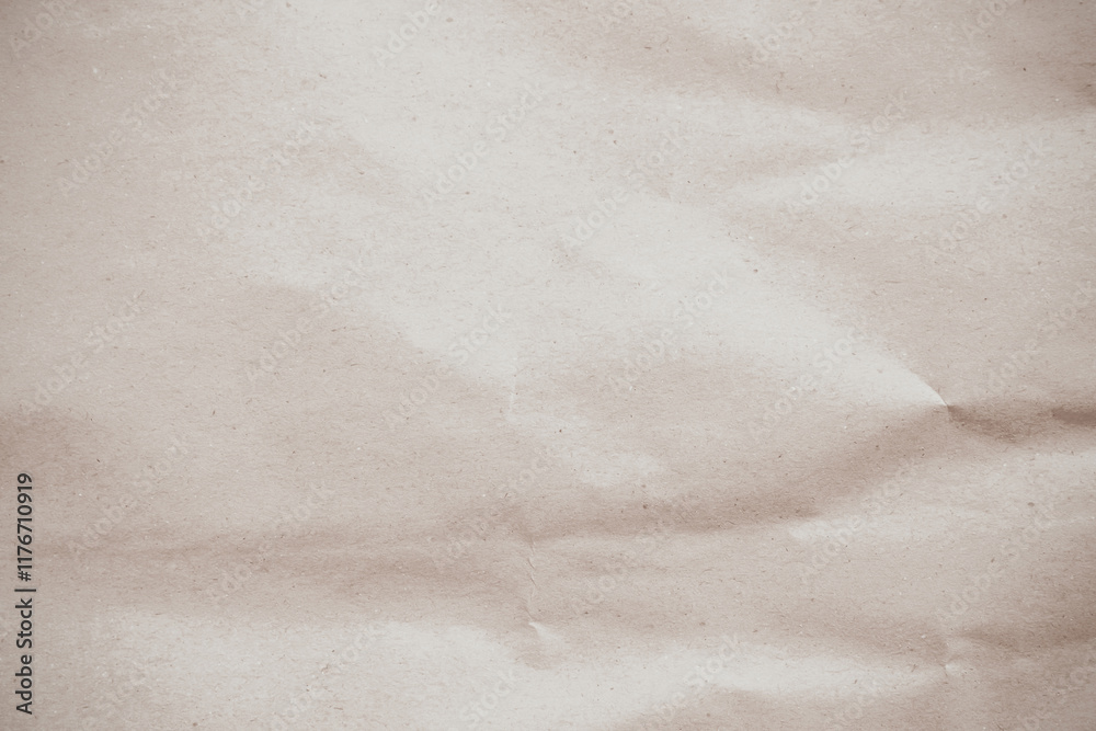 Naklejka premium Crumpled brown paper texture background for design with copy space for text or image.