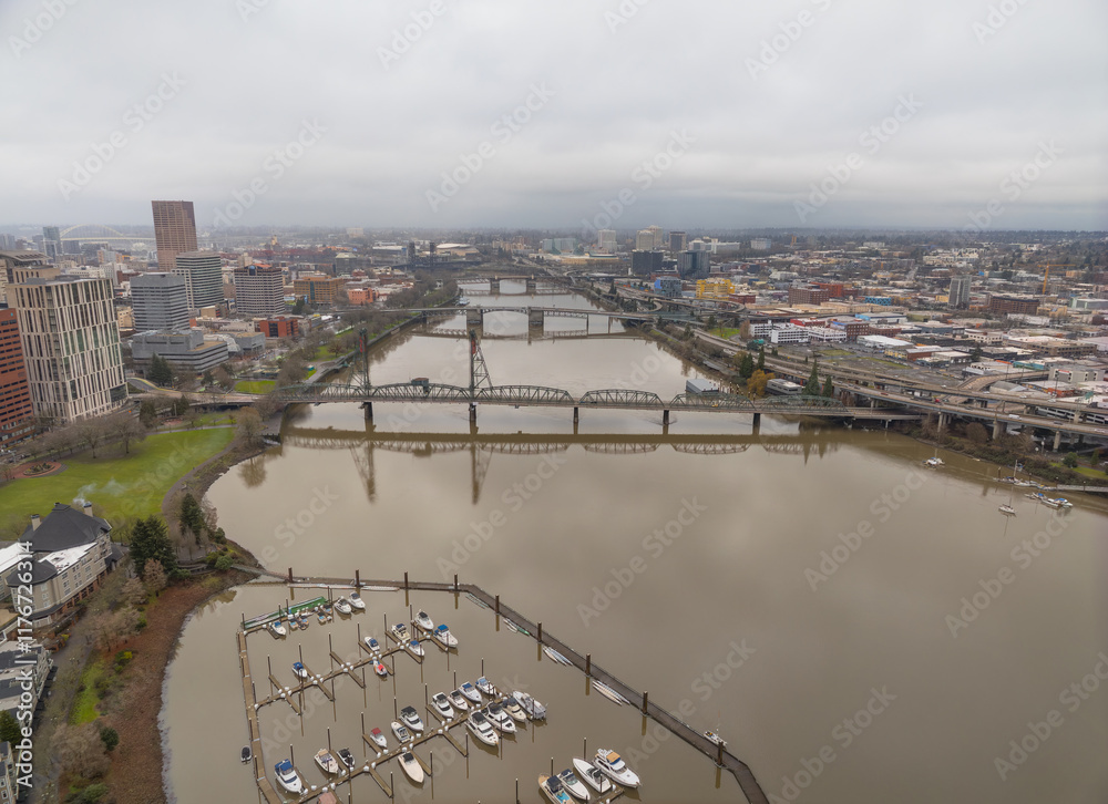 A city with a river running through it and a bridge over it