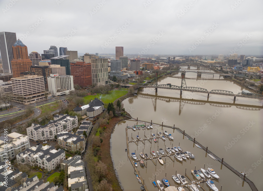 A city with a river running through it and a bridge over it