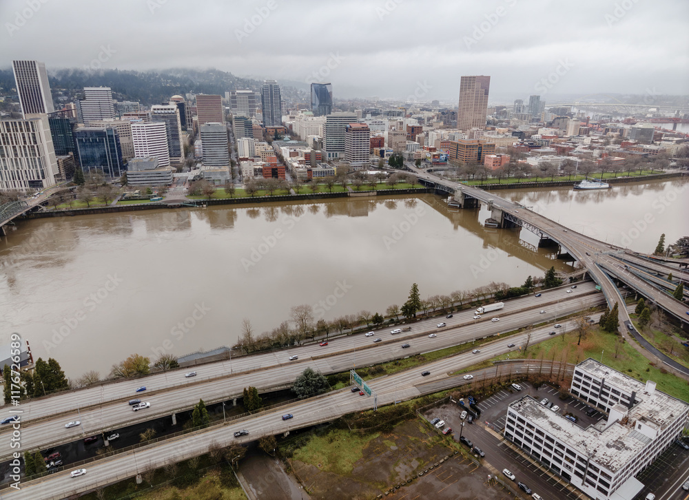 A city with a river running through it and a bridge over the water