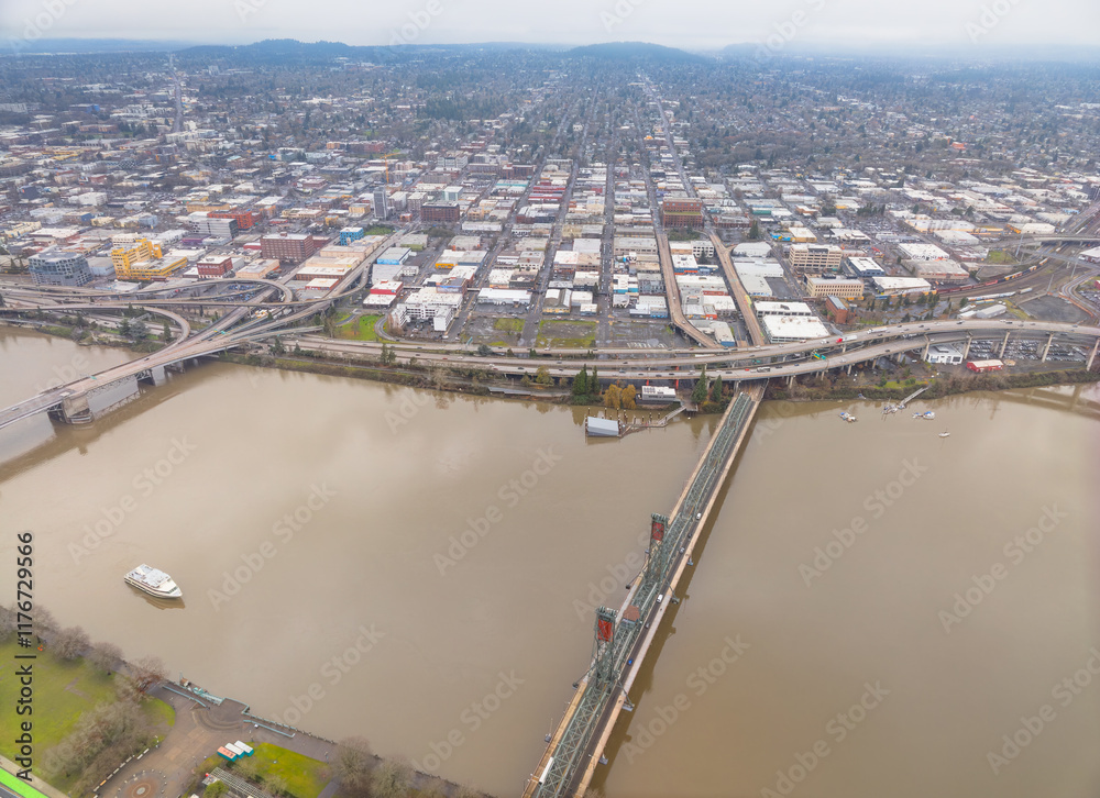 A city with a river running through it and a bridge over the water
