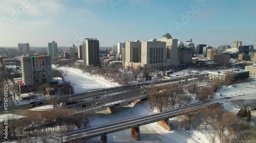 Main Street Bridge and Assiniboine River in winter, Winnipeg, Manitoba. 4K drone shot.