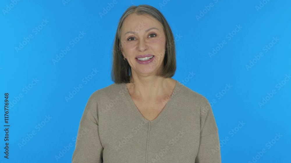 Talking Old Woman Doing Video Chat on Blue Background, Portrait Talking Old Woman Doing Video Chat on Blue Background, Portrait