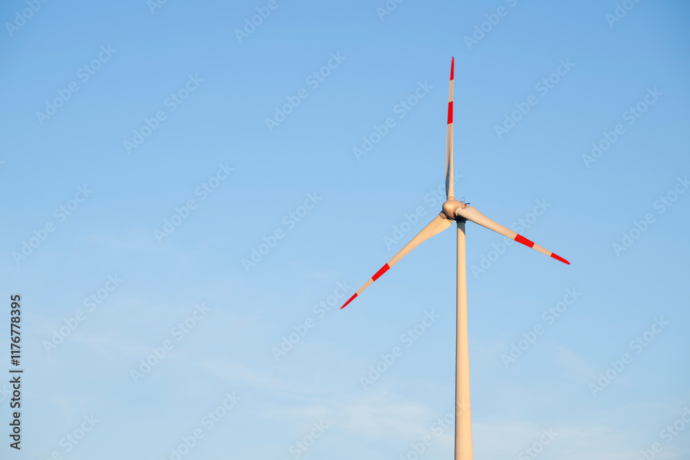 Wind turbine in Franconia, Bavaria, Germany against a clear blue sky Wind turbine in Franconia, Bavaria, Germany against a clear blue sky