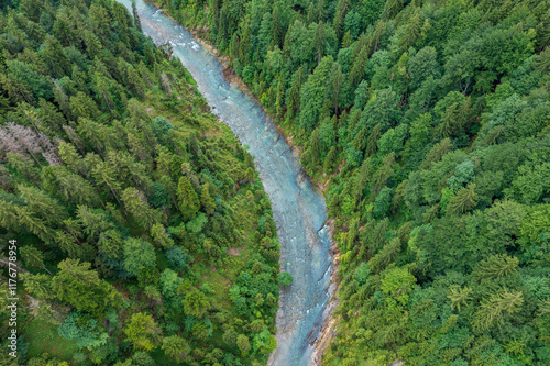 Aerial view of the wild Ammer River flowing through lush forests in summer, located in the Ammerschlucht Gorge, Upper Bavaria, Germany. photo