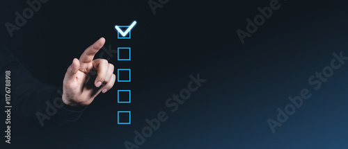 Hand pointing at glowing checkbox on dark background, checklist concept. photo