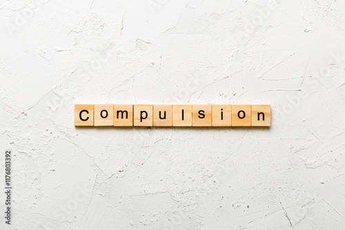 compulsion word written on wood block. compulsion text on table, concept