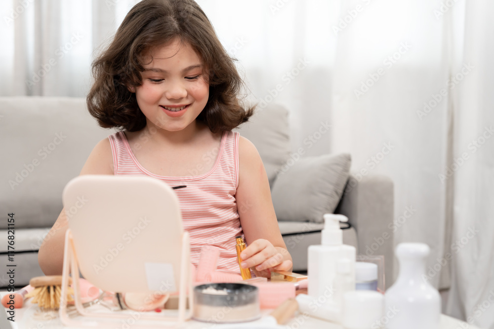 Happy children sit in front of a mirror makeup on face. Girl applying makeup. Advertisement, lifestyle , cosmetics, makeup accessories, beauty activity, beautician, talent, love beauty Happy children sit in front of a mirror makeup on face. Girl applying makeup. Advertisement, lifestyle , cosmetics, makeup accessories, beauty activity, beautician, talent, love beauty