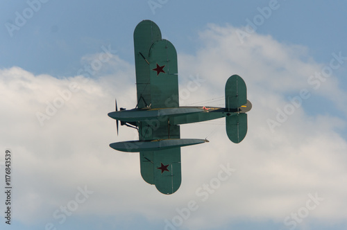 Seaplane U-2 or Po-2 (NATO codification: “Mule”) performs demonstration flight. Seaplane performs aerobatic maneuvers over sea. Close-up. Retro. Gelendzhik, Russia, September 4, 2014 photo