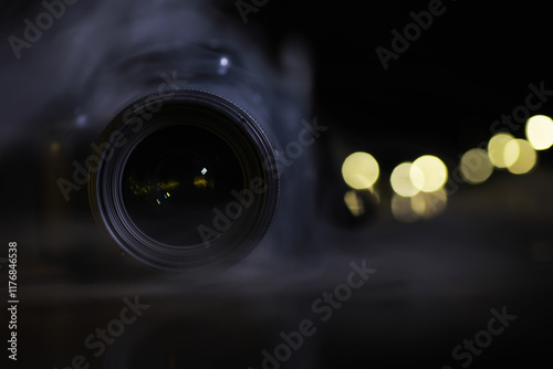 ** Close-Up of DSLR Camera Lens with Bokeh Light Effects in the Background