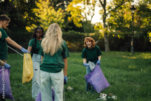 Group of people volunteers collecting rubbish in park