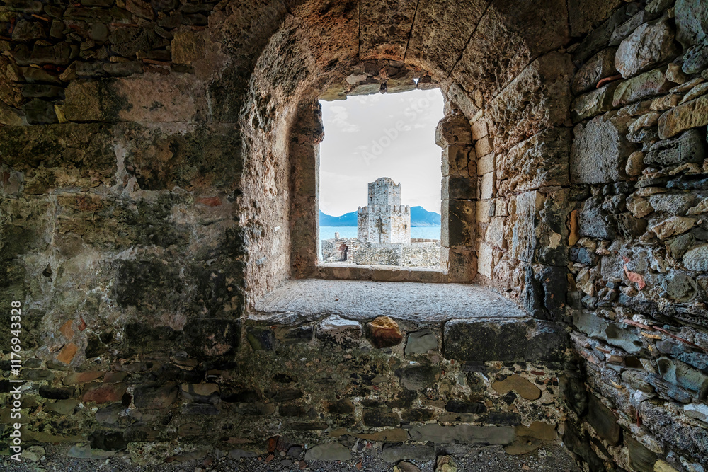 Bourtzi Tower Framed Through Stone Archway at Methoni Fortress Bourtzi Tower Framed Through Stone Archway at Methoni Fortress