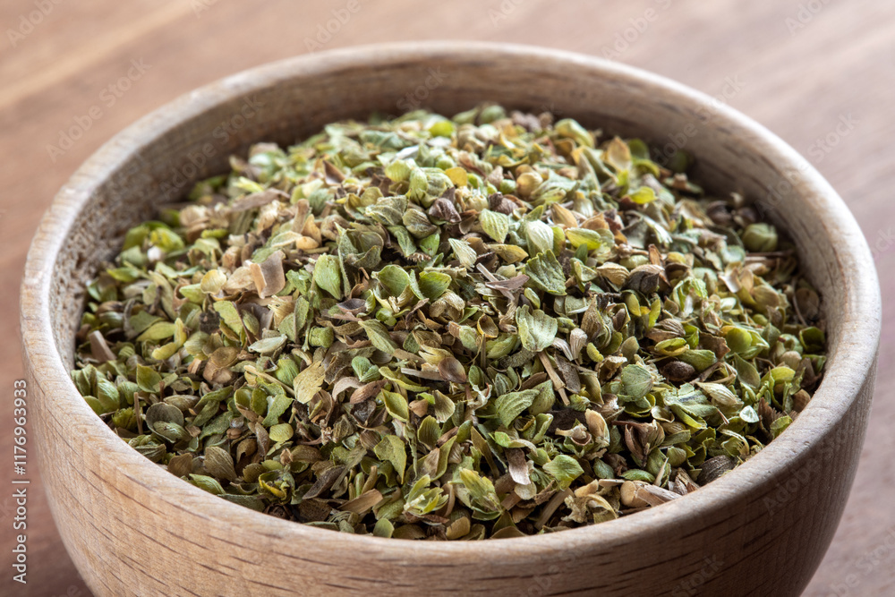 A bowl full of dried and ground organic mountain thyme on wooden table
A bowl full of dried and ground organic mountain thyme on wooden table