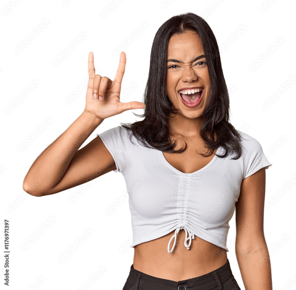 Young filipino woman showing a horns gesture as a revolution concept. Young filipino woman showing a horns gesture as a revolution concept.