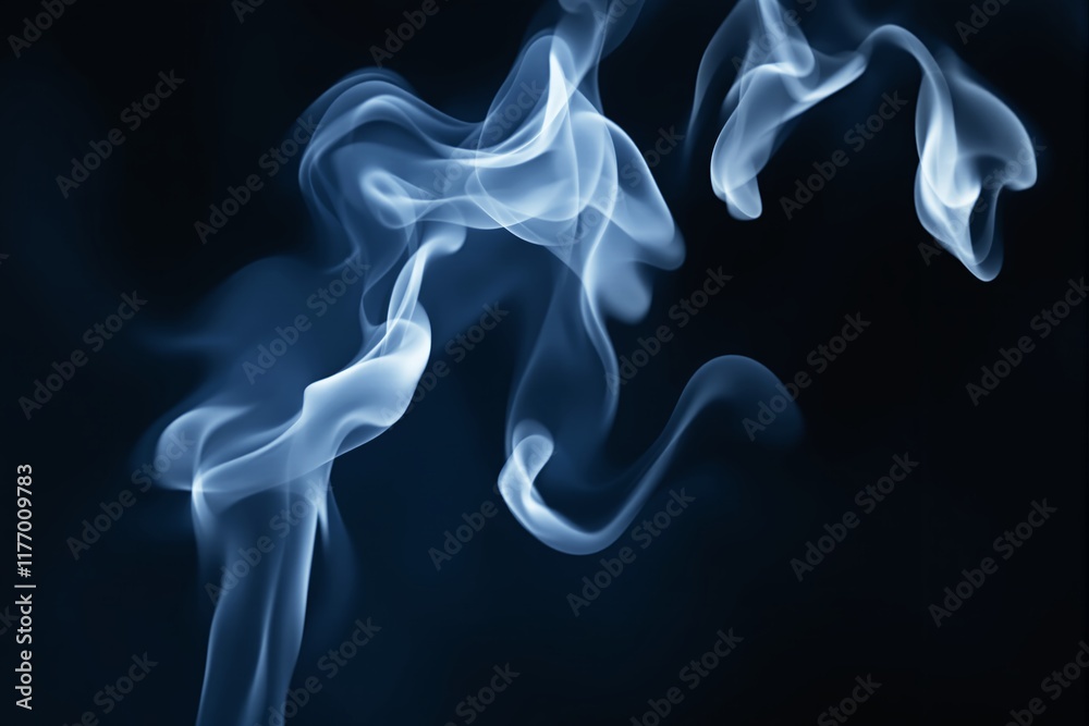 Fototapeta premium Abstract white smoke swirls on a dark blue background.