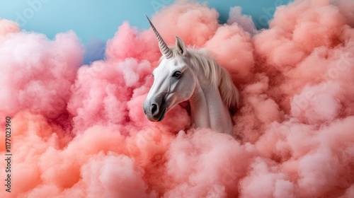 A stunning white unicorn emerges gracefully amidst lush, dreamy pink clouds against a soft blue sky, creating an enchanting fantasy scene filled with wonder. photo