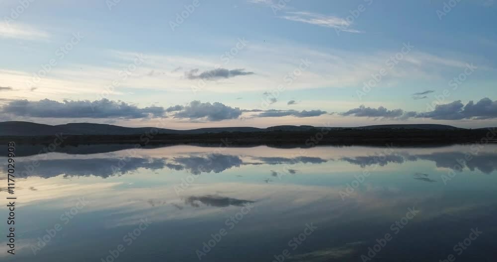 A Beautiful Tranquil Lake at Dusk with Cloud Reflections
