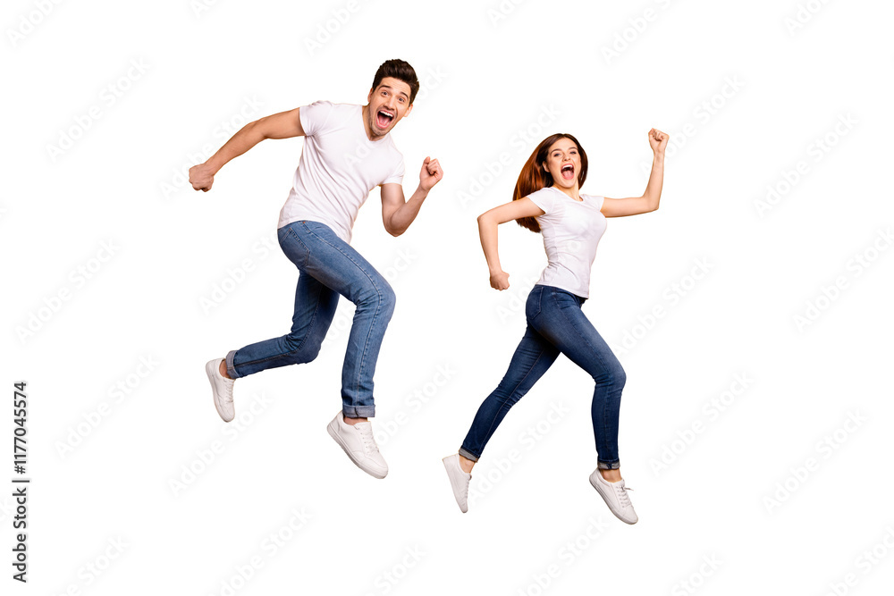 Full length side profile body size photo funky she her he him his pair jumping high hurry shopping raised fists yell scream shout loud wear casual jeans denim white t-shirts isolated yellow background Full length side profile body size photo funky she her he him his pair jumping high hurry shopping raised fists yell scream shout loud wear casual jeans denim white t-shirts isolated yellow background