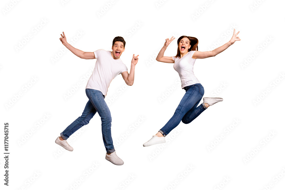 Full length side profile body size photo funky she her he him his pair jumping high yell scream shout fantastic mood show v-sign wear casual jeans denim white t-shirts isolated yellow background