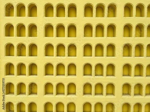 Arched shape pattern yellow colored wall. 